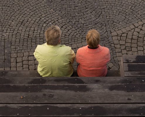 People-sitting-outside-upset